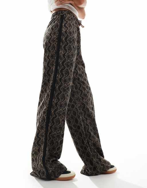 Monki drawstring wide leg pants in brown snake print with black side stripe  detail