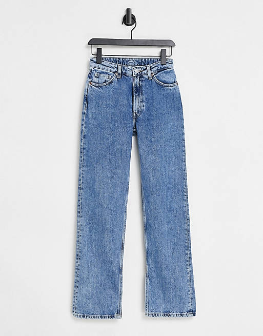 Women Monki Elsie organic cotton straight leg jeans with split hem in mid blue wash 