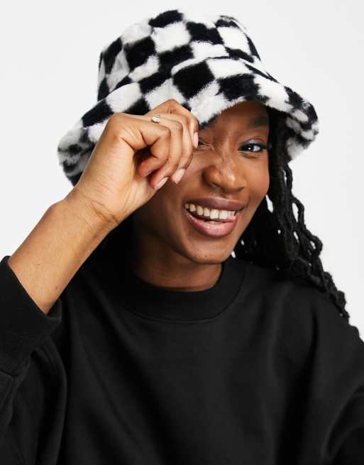 Monki faux fur checkerboard bucket hat in black and white