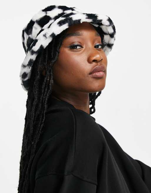 Monki faux fur checkerboard bucket hat in black and white