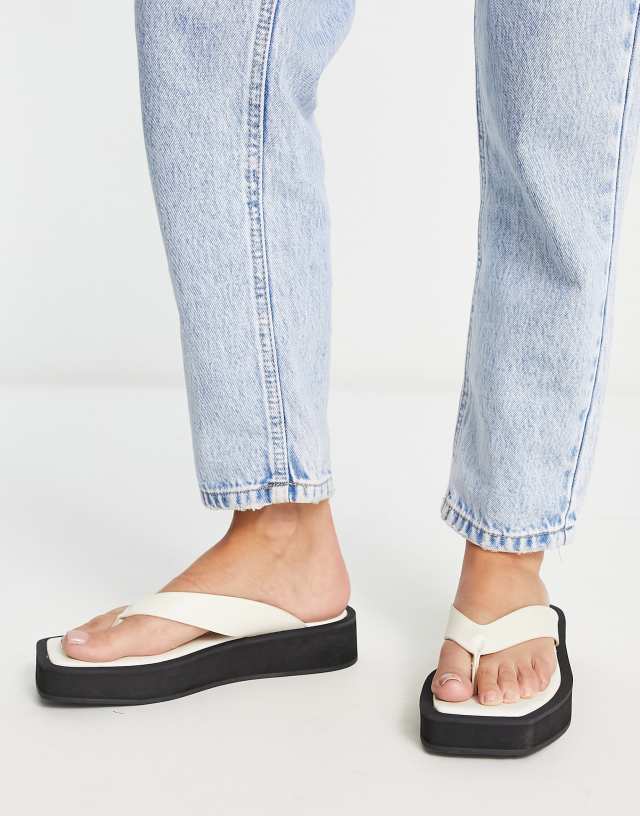 Monki faux leather thong sandals in black and white