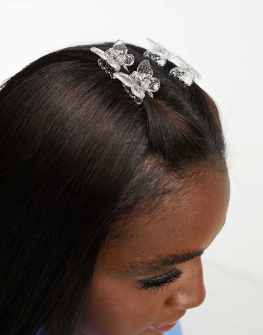 Monki - Fermagli per capelli a forma di farfalla color argento glitterato