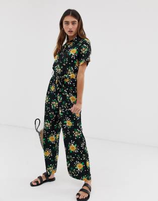 black jumpsuit with yellow flowers