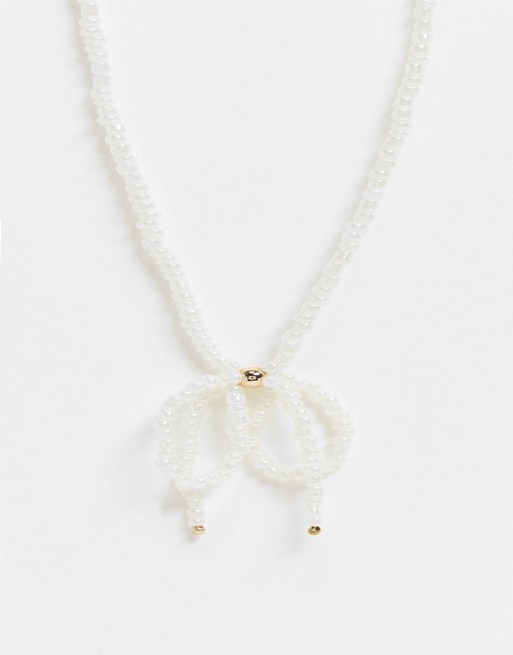 Monki Harper bow short pearl necklace in white