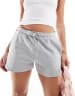 Monki heavy jersey shorts with curved hem in orange