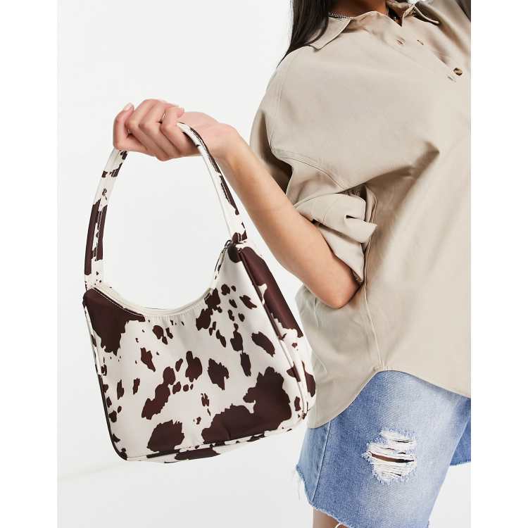 Monki Hilma recycled shoulder bag in cow print ASOS