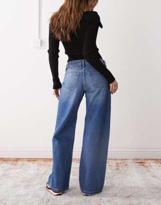 Monki Imoo Low Waisted Wide Fit Jeans In Gabby Blue Wash With Spray In Blue