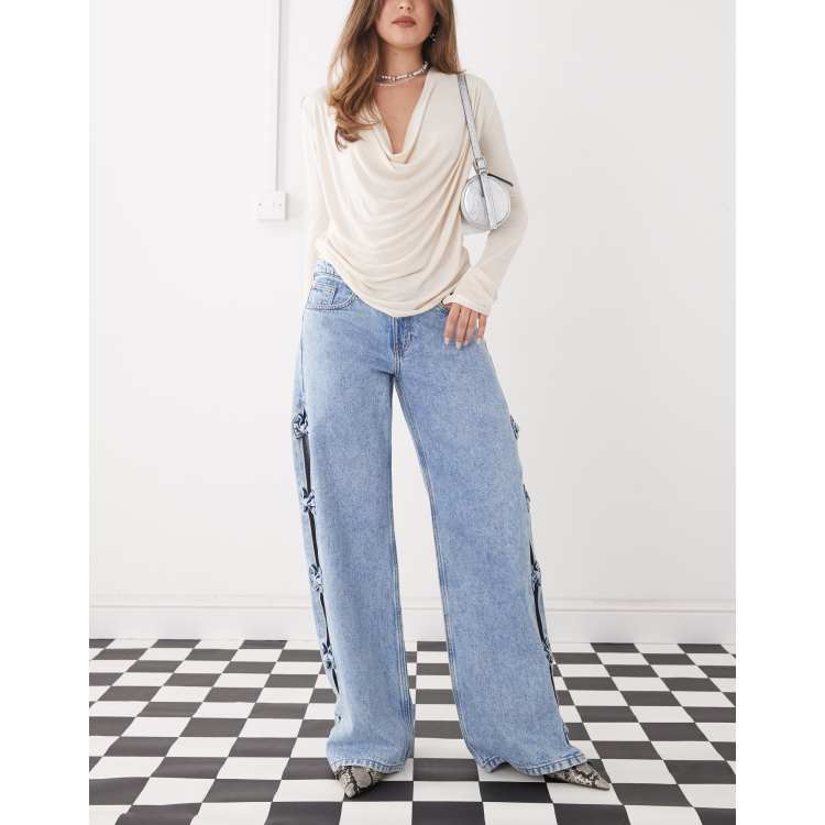 Monki Imoo low waist wide leg jeans with cut out bow details