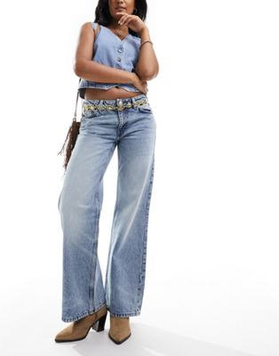 Monki Imoo low waisted wide fit jeans in tinted dirty wash blue