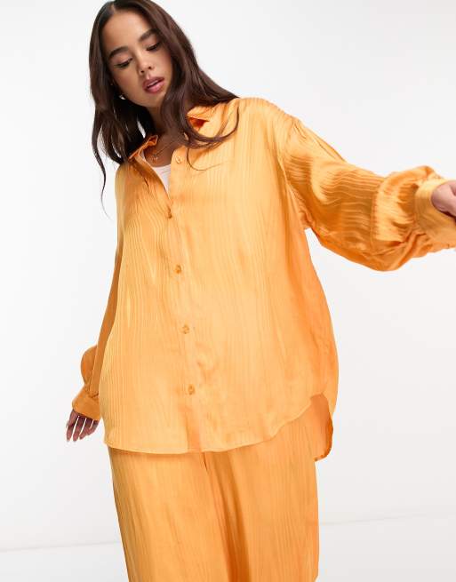 Monki crinkle shirt with long sleeve in orange