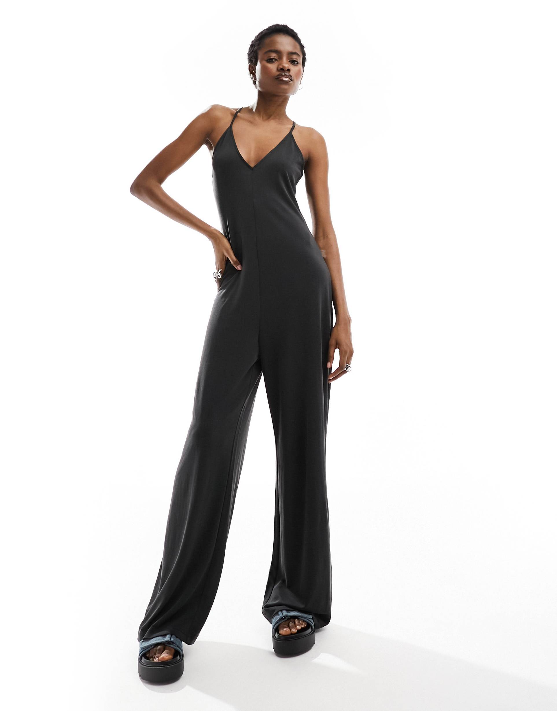 monki jersey jumpsuit in with cross back straps in black