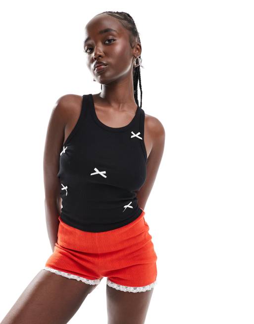Monki jersey tank top in black with white applique bows 