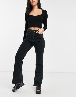 Monki Kaori organic blend cotton flared jeans in black | ASOS