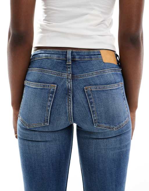 Monki Katsumi low rise flared leg jeans in blue fade wash 