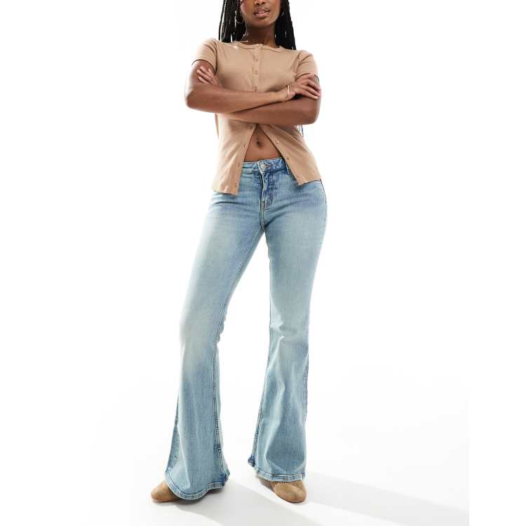 Monki Katsumi low rise flared leg jeans in tinted dirty wash