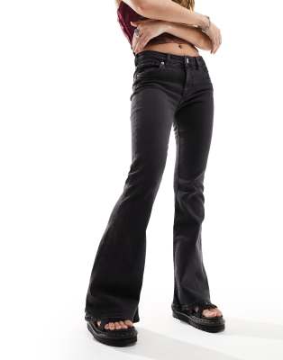 Katsumi low rise flared leg jeans in washed black