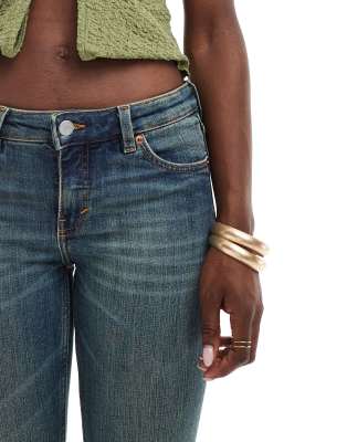Monki Katsumi low waist boot cut flared jeans in dark blue wash