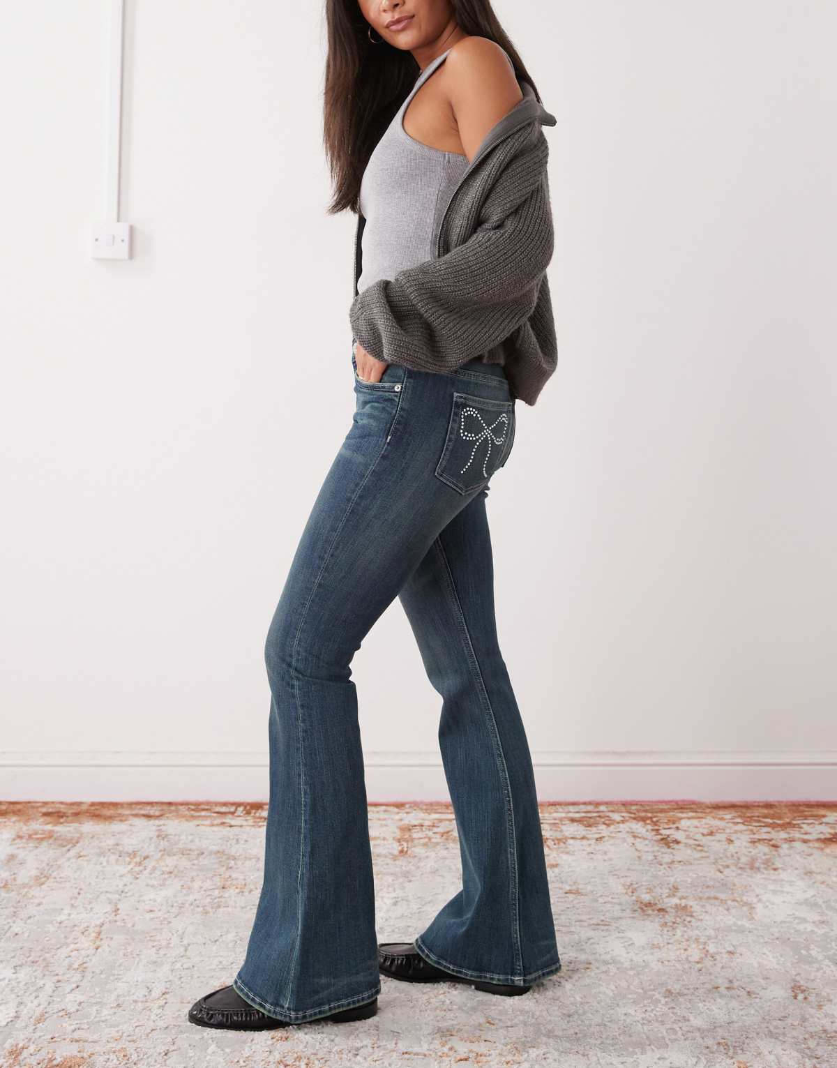 Monki Katsumi low waist flare jeans with bow embellishment