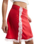 Monki lace trim mini skirt with thigh split in red