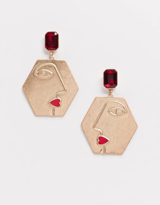 Monki - Lilly - Pendants d'oreilles motif visage avec pierres fantaisie - Doré et rouge