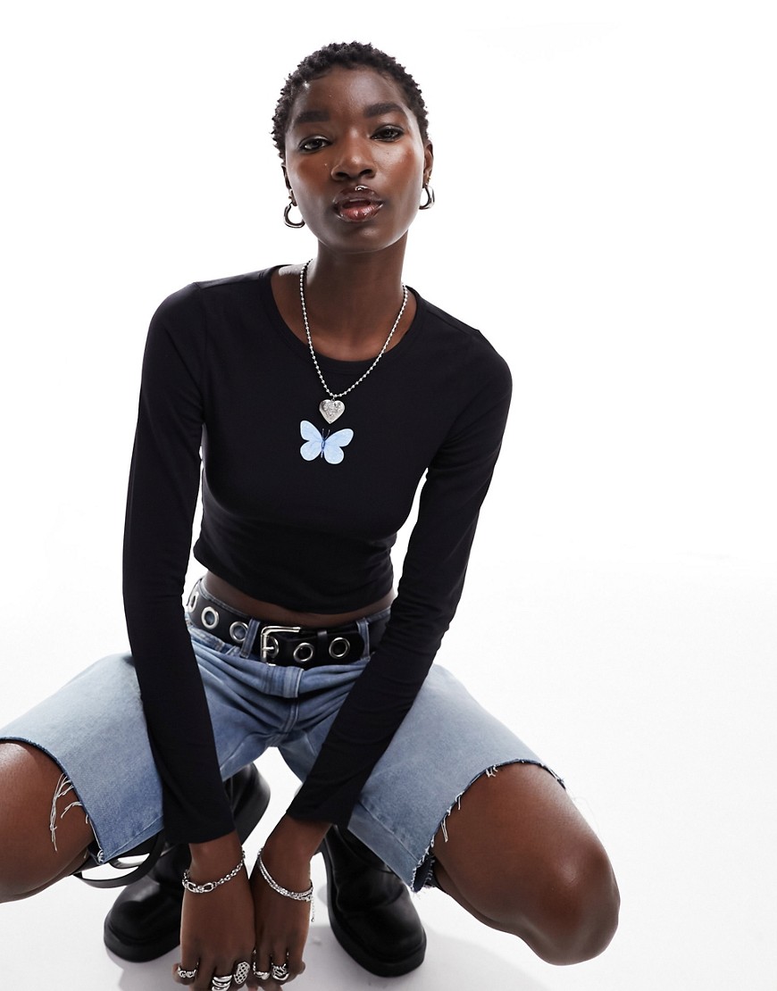 Monki long sleeve cropped top in black with butterfly front print