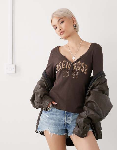 Monki long sleeve henley button top with flared sleeves and yellow varsity print in washed chocolate brown - view 1