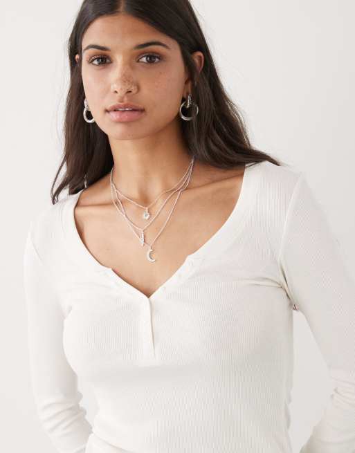Monki long sleeve Henley button top with flared sleeves in off-white