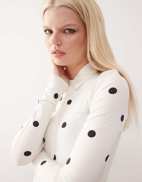 Monki long sleeve jersey shirt bodysuit in white and black polka dot - view 1