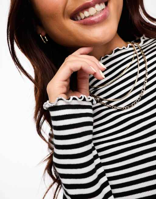 Monki long sleeve lettuce edge high neck top in black and white