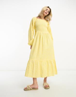 long sleeve midi dress with ruffled hem in yellow gingham