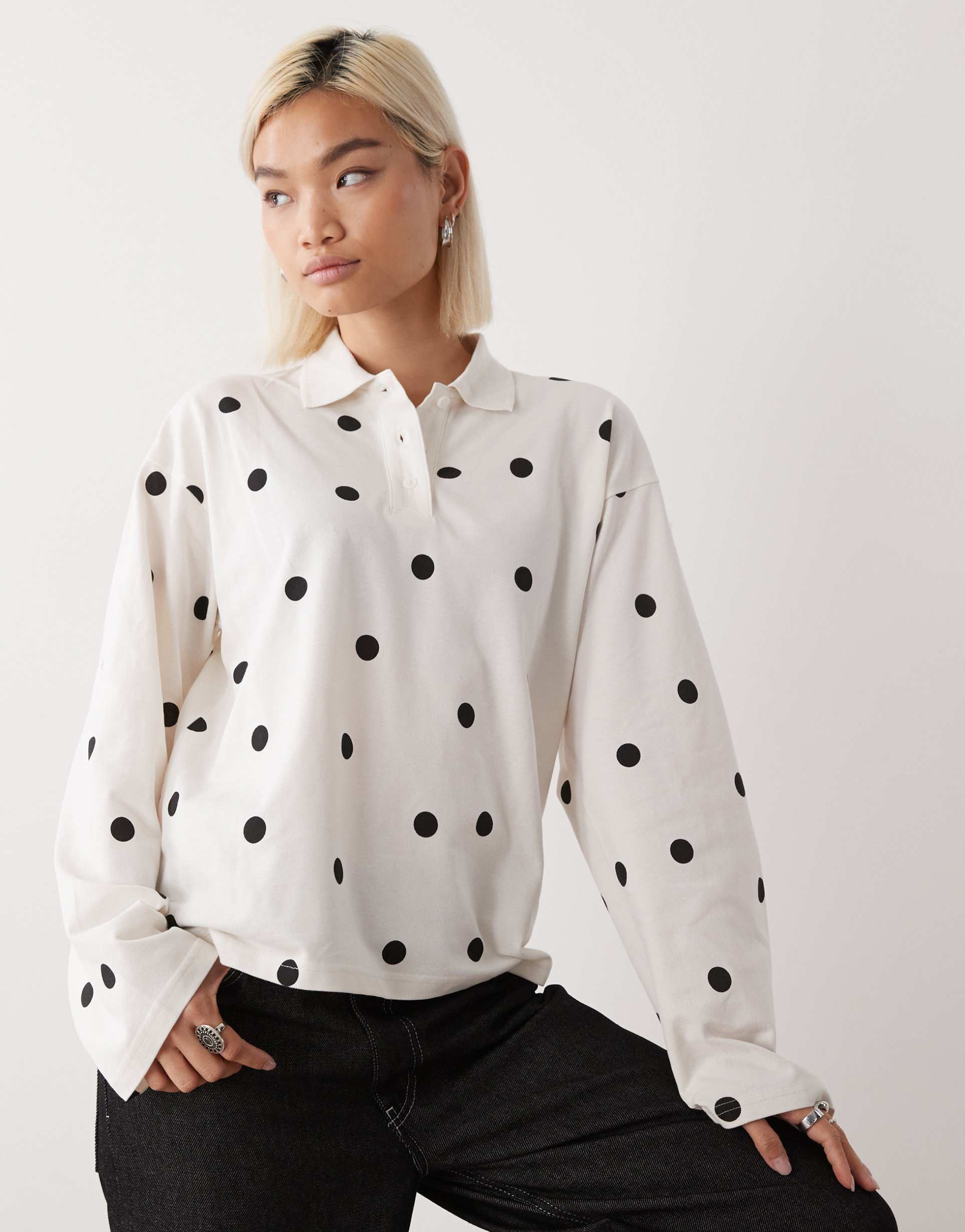monki long sleeve oversized rugby polo in white and black polka dot