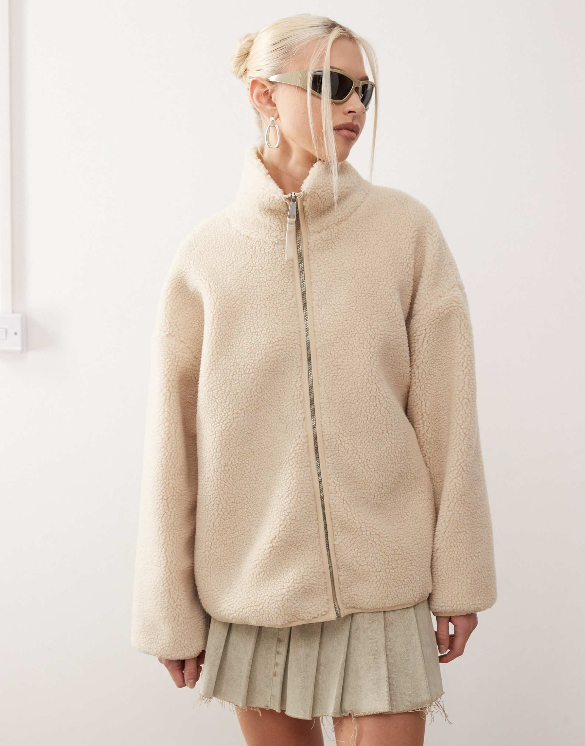 monki long sleeve zip through fleece with contrasting trims in off white with pink floral lining