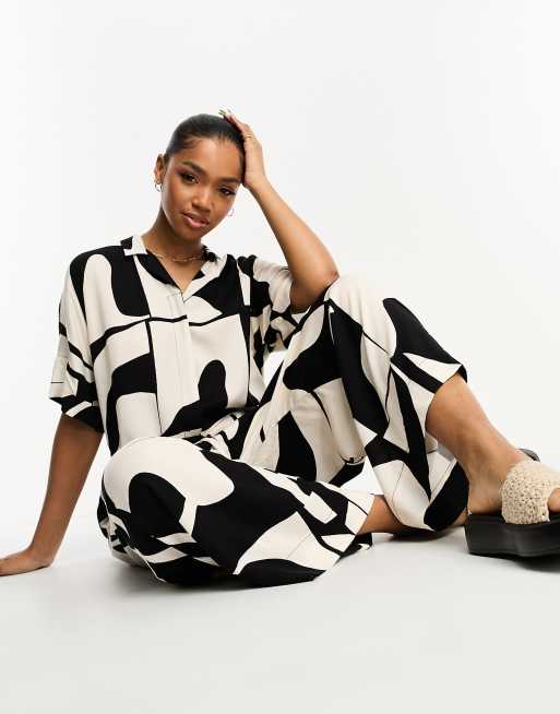 Monki loose fit jumpsuit in black and cream abstract print ASOS