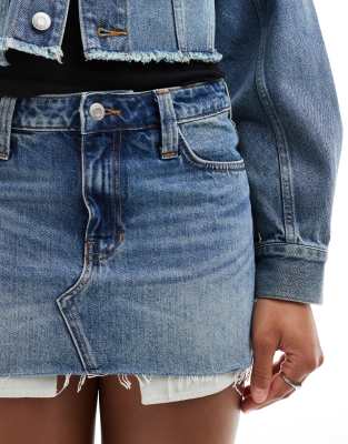 monki low waist denim mini skirt in mid blue wash