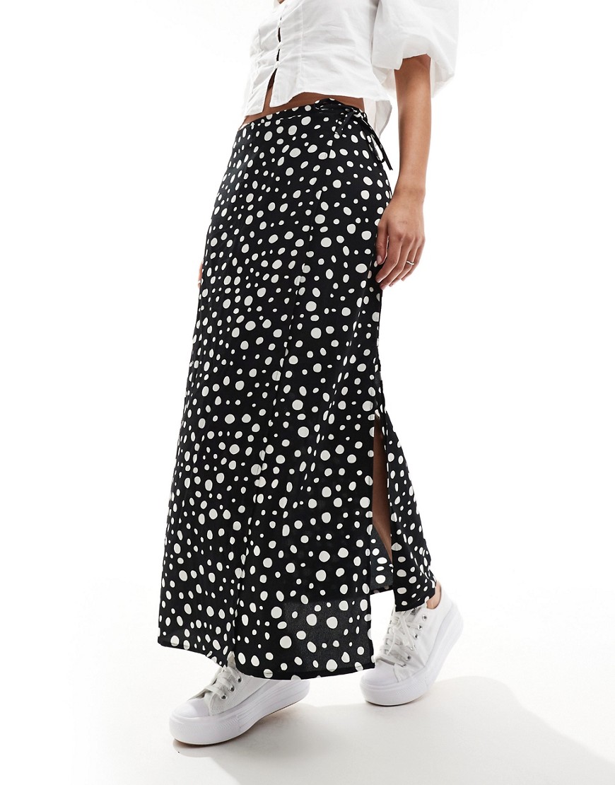 Monki midi skirt with tie waist in black with white dots