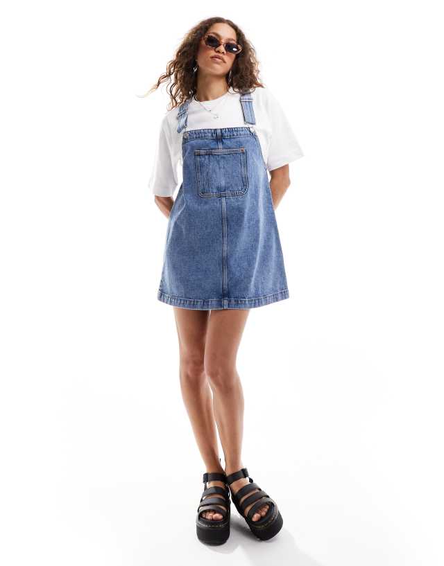Monki mini denim overall dress in midwash blue