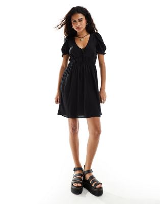 Monki mini smock dress with puff sleeves in black