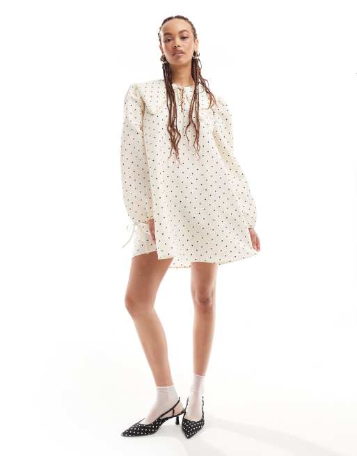 Monki mini swing dress with collar and tie cuffs in white polka dots print  | ASOS