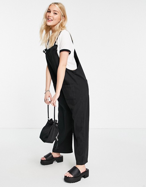 Monki Mona organic cotton dungarees with front pockets in black