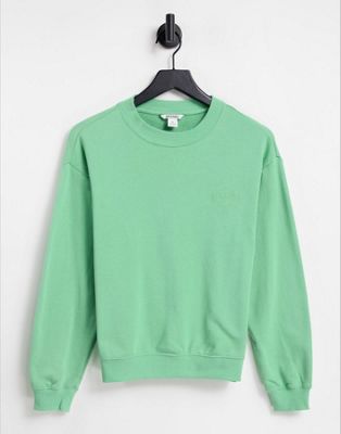 Monki Nana cotton happy logo sweatshirt in green - MGREEN