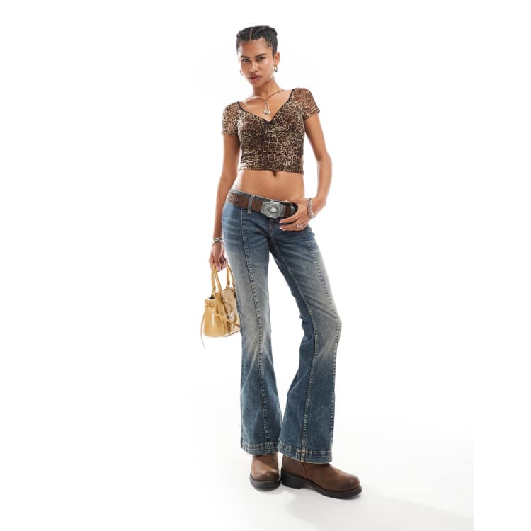 Monki Nicole low waist flared jeans with seam details in darkwash