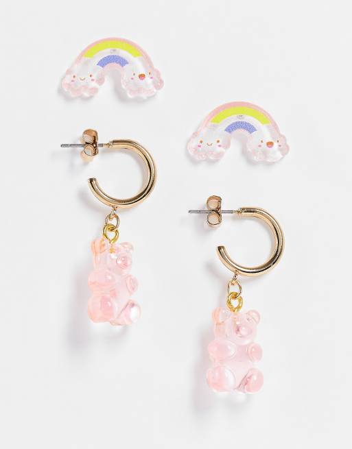 Monki - Orecchini rosa con ciondolo a forma di orsetto e arcobaleno