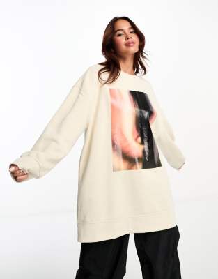 Monki oversized sweatshirt in off white with front eye print