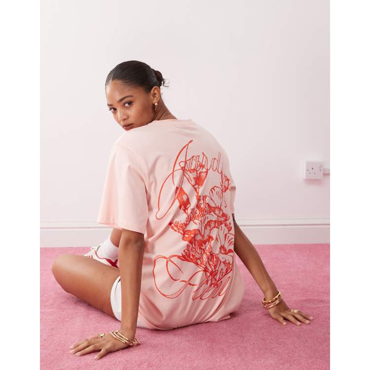 Monki oversized t-shirt with orange flower graphic in light pink