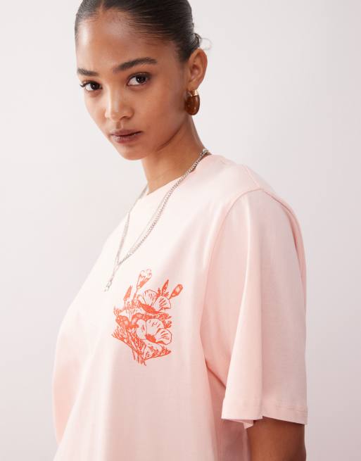 Monki oversized t-shirt with orange flower graphic in light pink