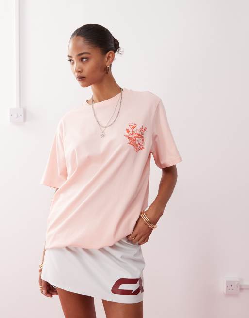 Monki oversized t-shirt with orange flower graphic in light pink