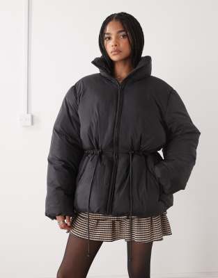 Monki oversized tie cinch waist puffer jacket in black | ASOS
