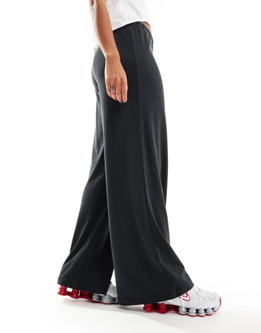 Monki - Pantaloni morbidissimi a vita bassa e fondo ampio nero in jersey