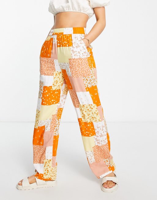 Monki patterned patchwork pants in orange