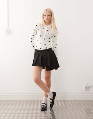 Monki Pleated Mini Skirt With Asymmetric Hem In Black